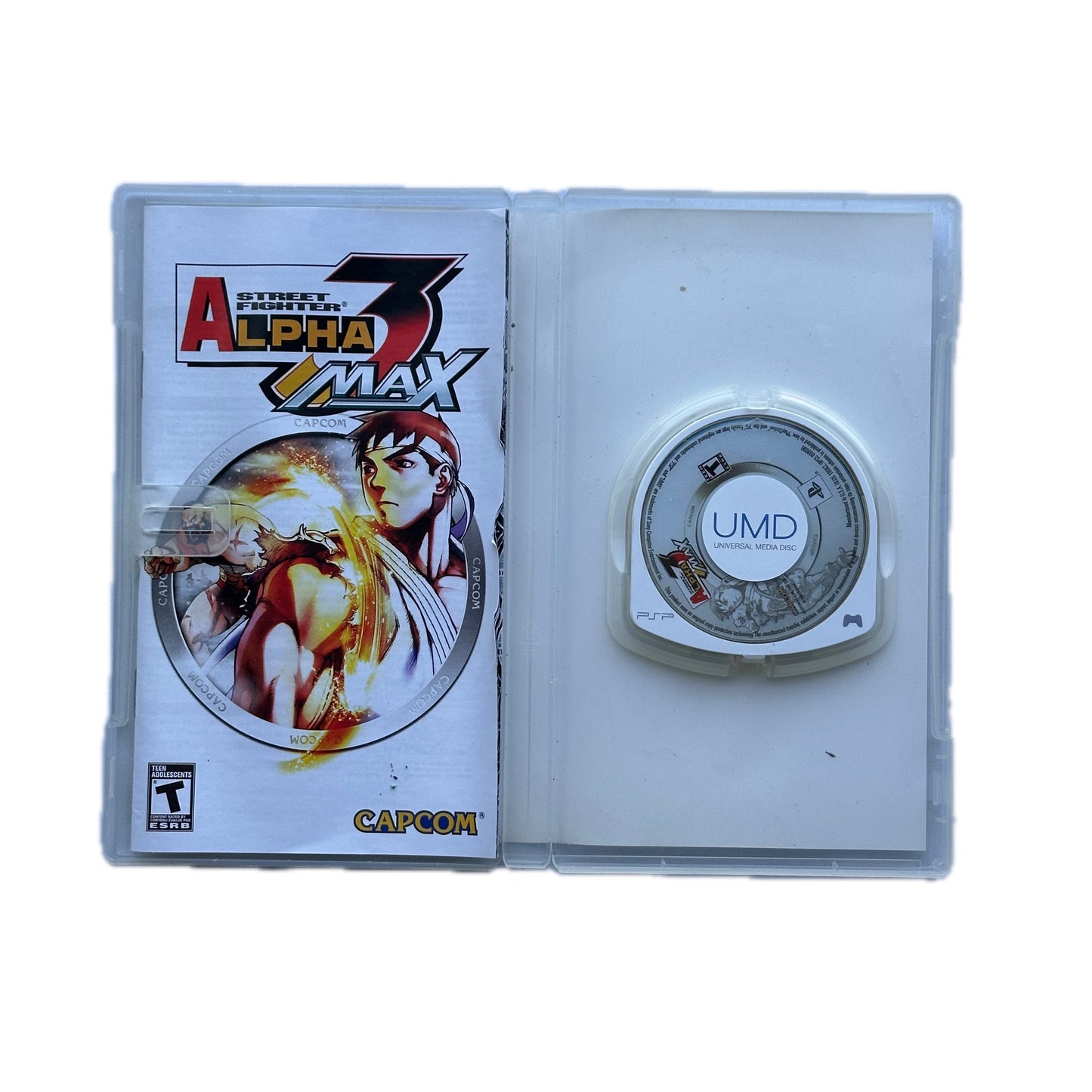 Game cartridge with UMD disc and 'Street Fighter Alpha 3' cover on a white background