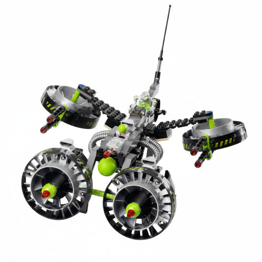 Toy robot with green accents on a white background
