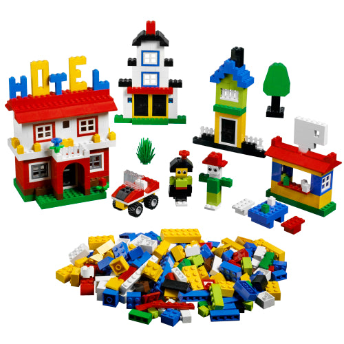 Colorful toy building blocks with various structures and figures on a white background