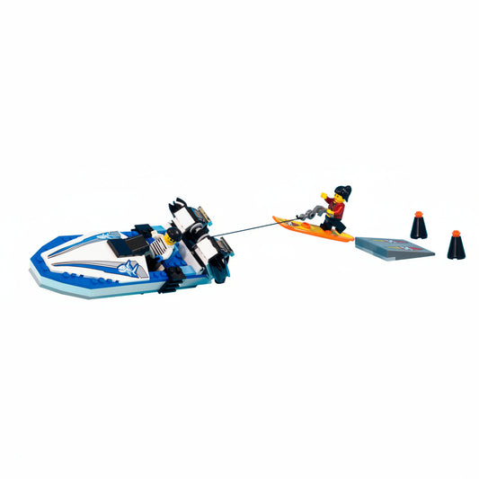Toy set with a blue and black vehicle pulling a person on a kayak.